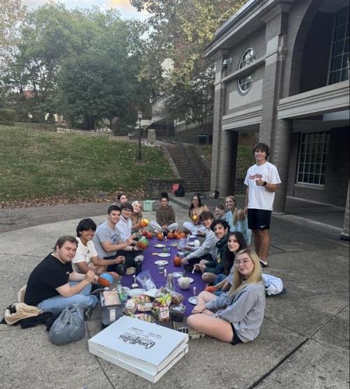 Pre-Law students paint pumpkins outside of Scripps Hall