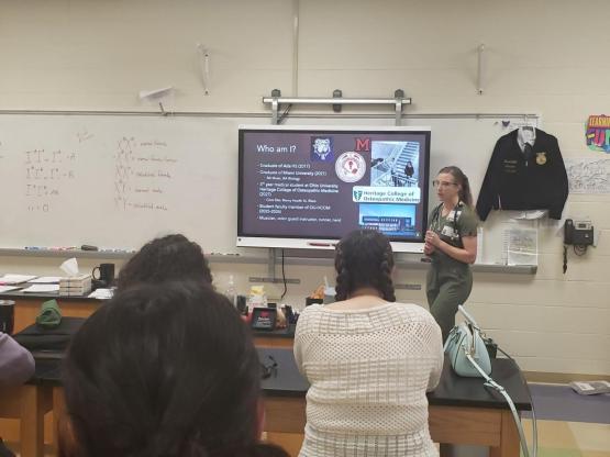 Medical student Libbie Milks speaks with high school students about medicine as part of the LIC.  