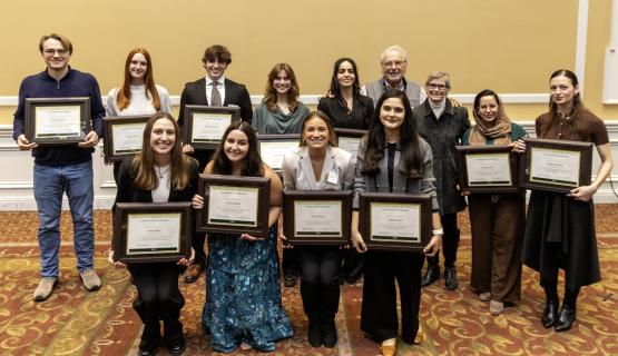 John Kopchick and Char Kopchick stand with the award winners, who are holding their awards
