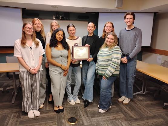 Ohio University SPJ members stand together and hold the national award