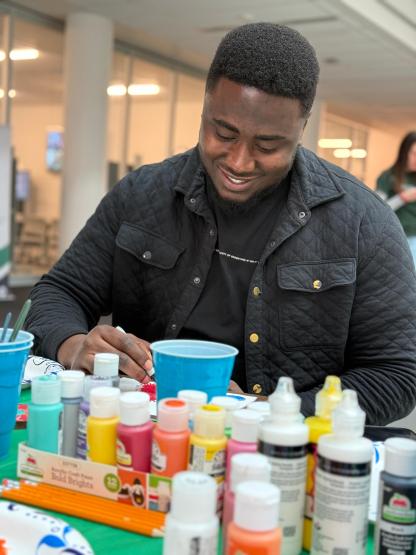 A student participates in the art event to mark World Antimicrobial Resistance Awareness Week