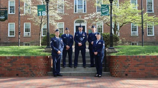 Members of the Ohio University Air Force ROTC stand in their uniforms in front  of Cutler Hall