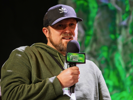 Man speaking into microphone