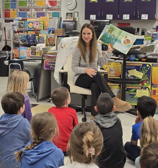 Ava Eldridge reads to students