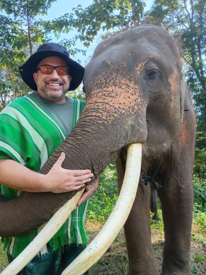 Phillip Howard visits with an elephant