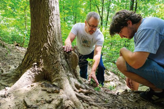 Professor Harvey Ballard and research assistant Collin Thacker examine specimens of newly discovered species of violets during a research expedition. Photo by Ben Wirtz Siegel, BSVC ’02 