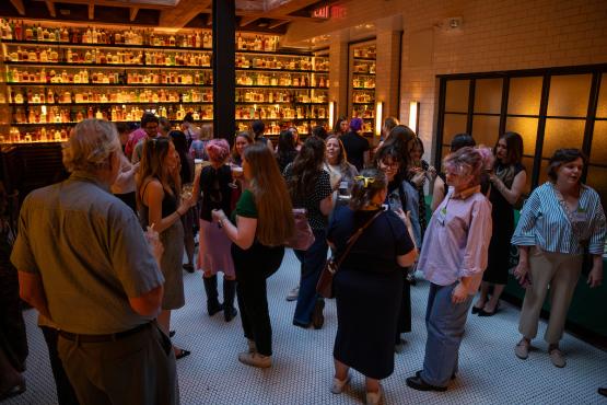 OHIO students talk with alumni at a social event in New York City