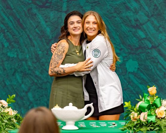 Cheyanne Maynard hugs an OHIO student during the Nurse Pinning Ceremony