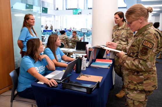 National Guard members and staff from the county health department prepare to assist patients