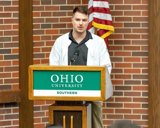 Wesley Malavenda speaks at the podium during the Pinning Ceremony