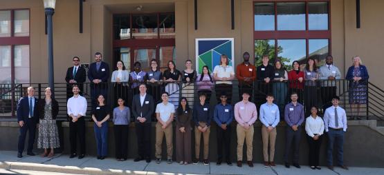 The 2026 MORPC interns stand together for a photo while they are outside in front of a building