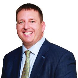 A headshot of Chris Bellamy