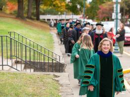 President Lori Stewart Gonzalez leads the procession of delegates into the investiture ceremony