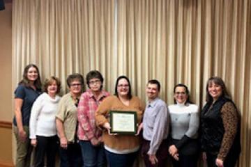 Jessica Barton (center holding certificate) with Classified Senate members