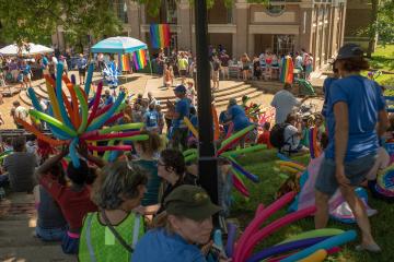 Athens Community members gather to listen to speakers following the city's  first PRIDE PARADE in 2018. 