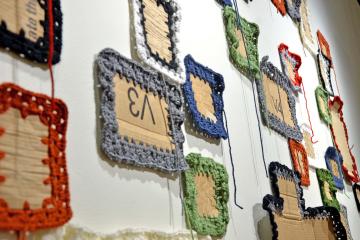 Artwork made of recycled cardboard and crocheted yarn