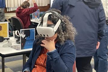 Kelly Broughton is shown wearing virtual reality technology