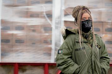 Woman standing in front of food bank 