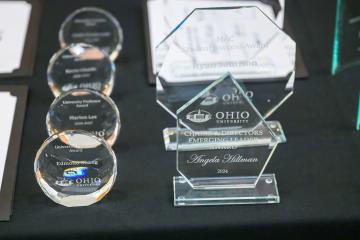Several of the awards are shown on a table