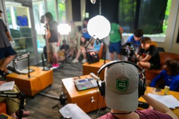 Students working in podcast studio