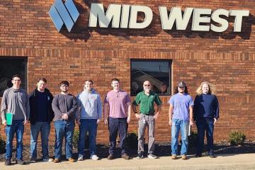 OHIO students and faculty stand with Mid-West Fabricating representatives outside of the Mid-West Fabricating building in Amanda, Ohio