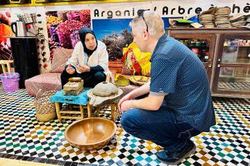 Jeff Kuhn teaches in Morrocco in a public market 