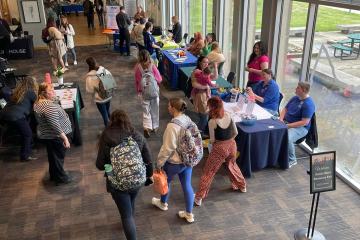 Students and community members visit tables and talk with representative at the Social Work Resource Fair at Ohio University Lancaster