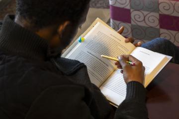A student reading at the Drop Everything and Read event
