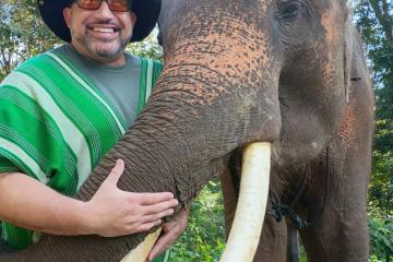 Phillip Howard visits with an elephant