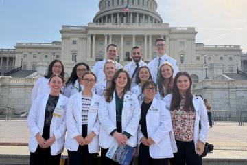 HCOM students pose in front of the Capitol in Washington D.C.
