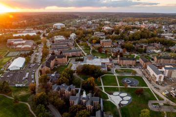 Ohio University's Athens campus and the countryside behind it is shown from above in this aerial image