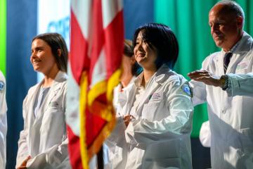 HCOM students receive their white coats