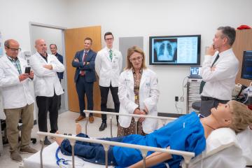 Ohio Rep. Beryl Brown Piccolantonio looks at mannequin in clinical skills training
