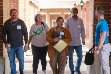 conference attendees walking outside in a group