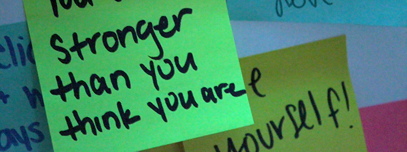 Sticky note that says "You are stronger than you think you are"