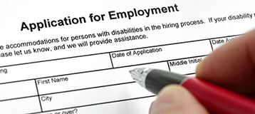 application for employment being filled out with a pen