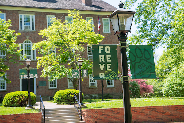 Banner reads Forever OHIO in front of Cutler Hall