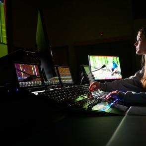 students controlling the sound for an event