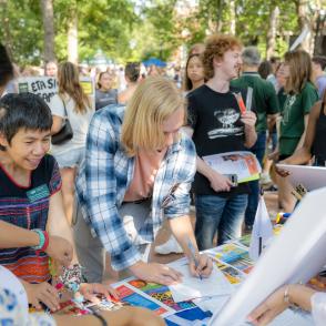 students at the involvement fair on college green