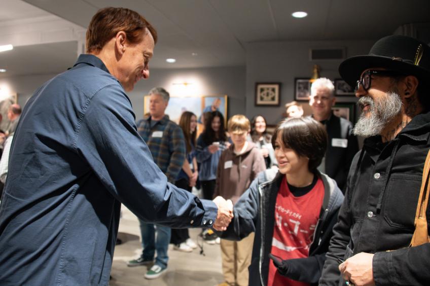 Tony Hawk shaking hands with an attendee