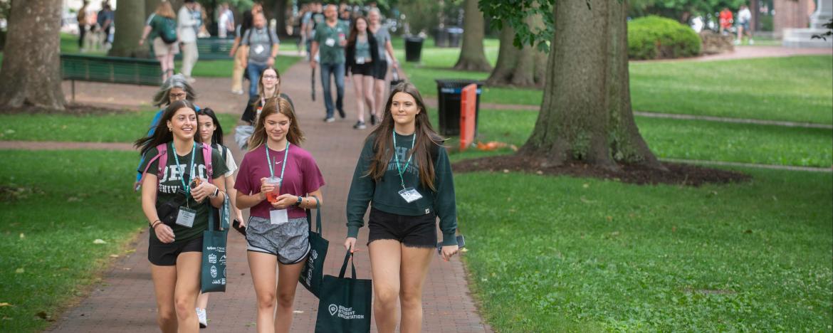 orientation participants walking on college green