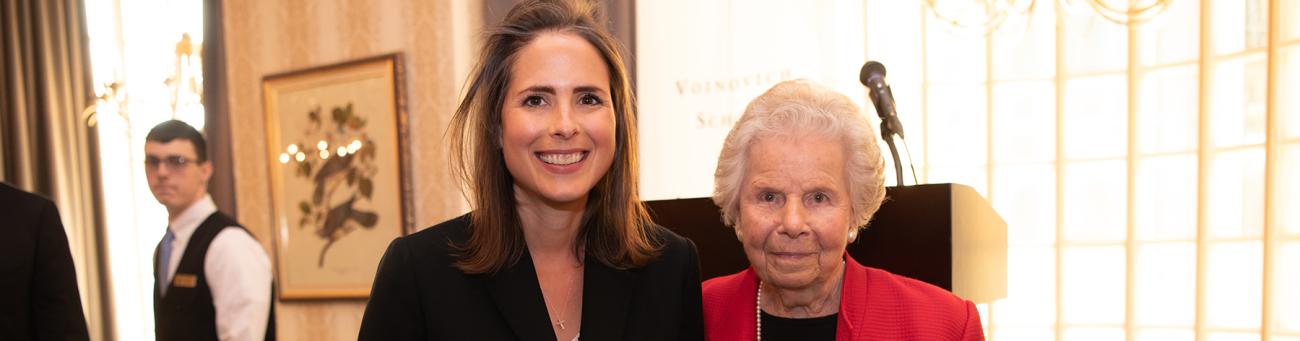 Cara Dingus Brooke and JoAnn Davidson standing together at the Alumni government award ceremony