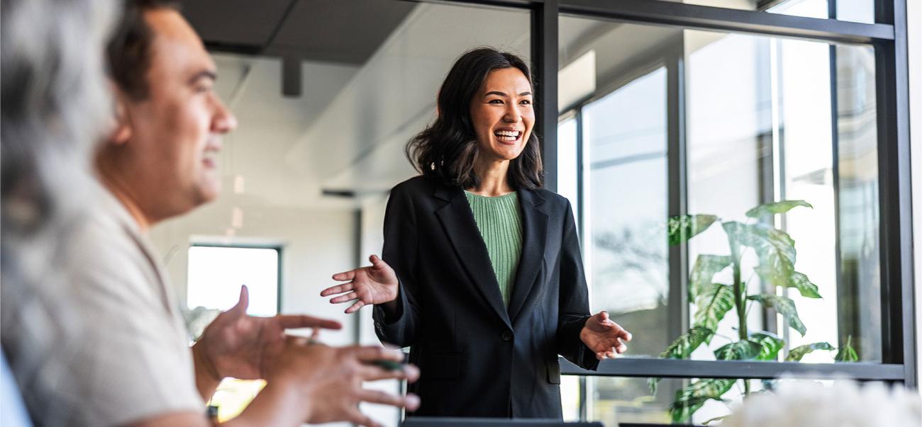 Female nonprofit fundraising manager meeting with coworkers