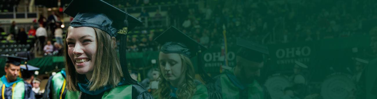 A woman and others at commencement ceremony. 