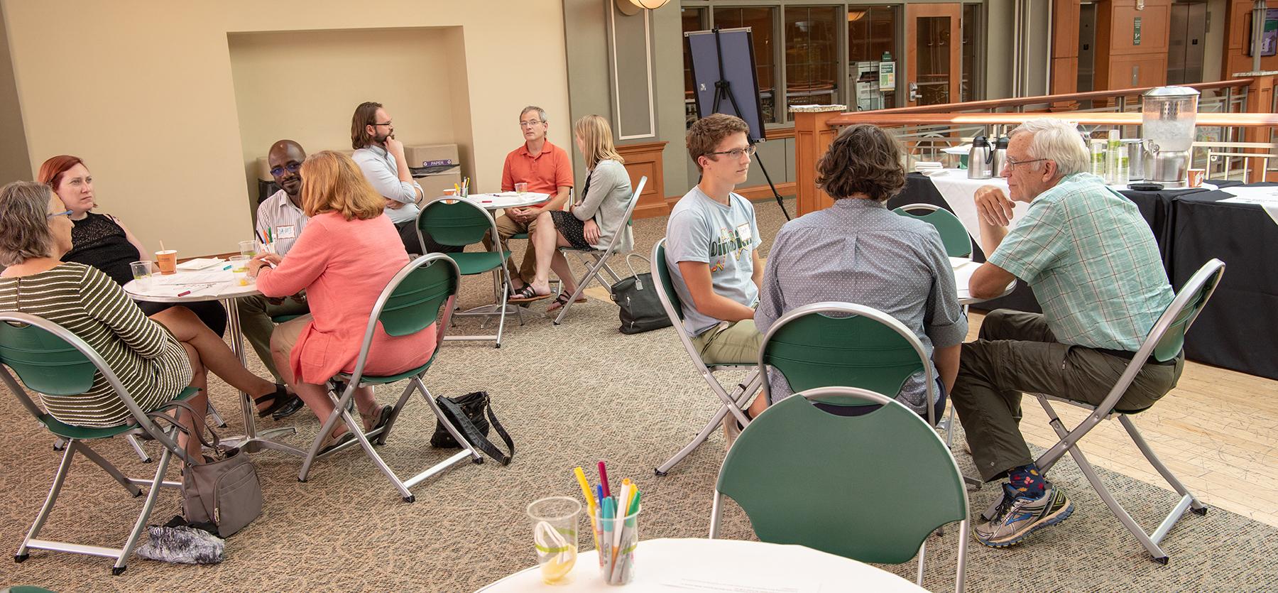 Faculty and community members engage in discussion during an Open OHIO gathering