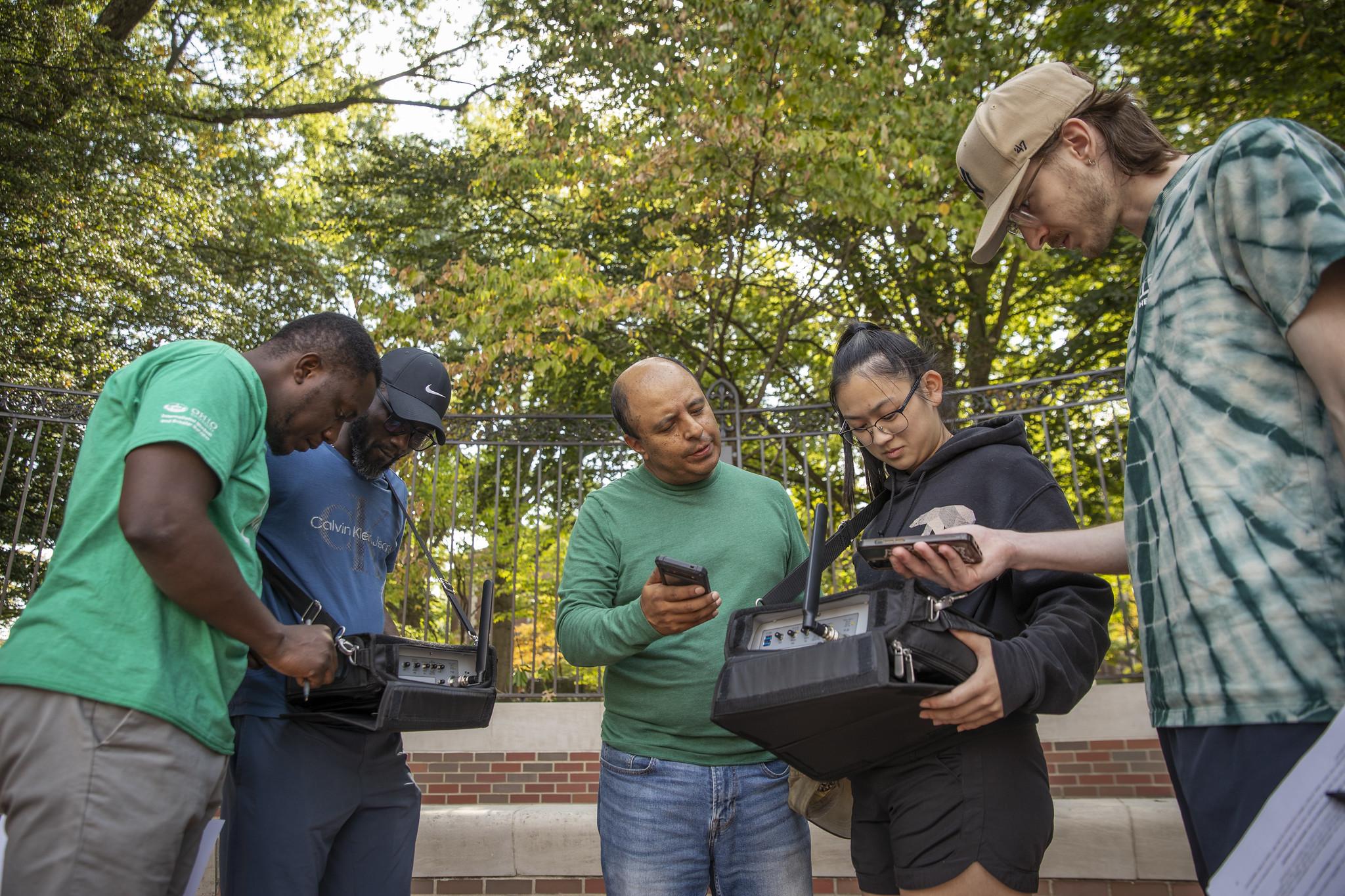 students and teacher work on 5G training activities
