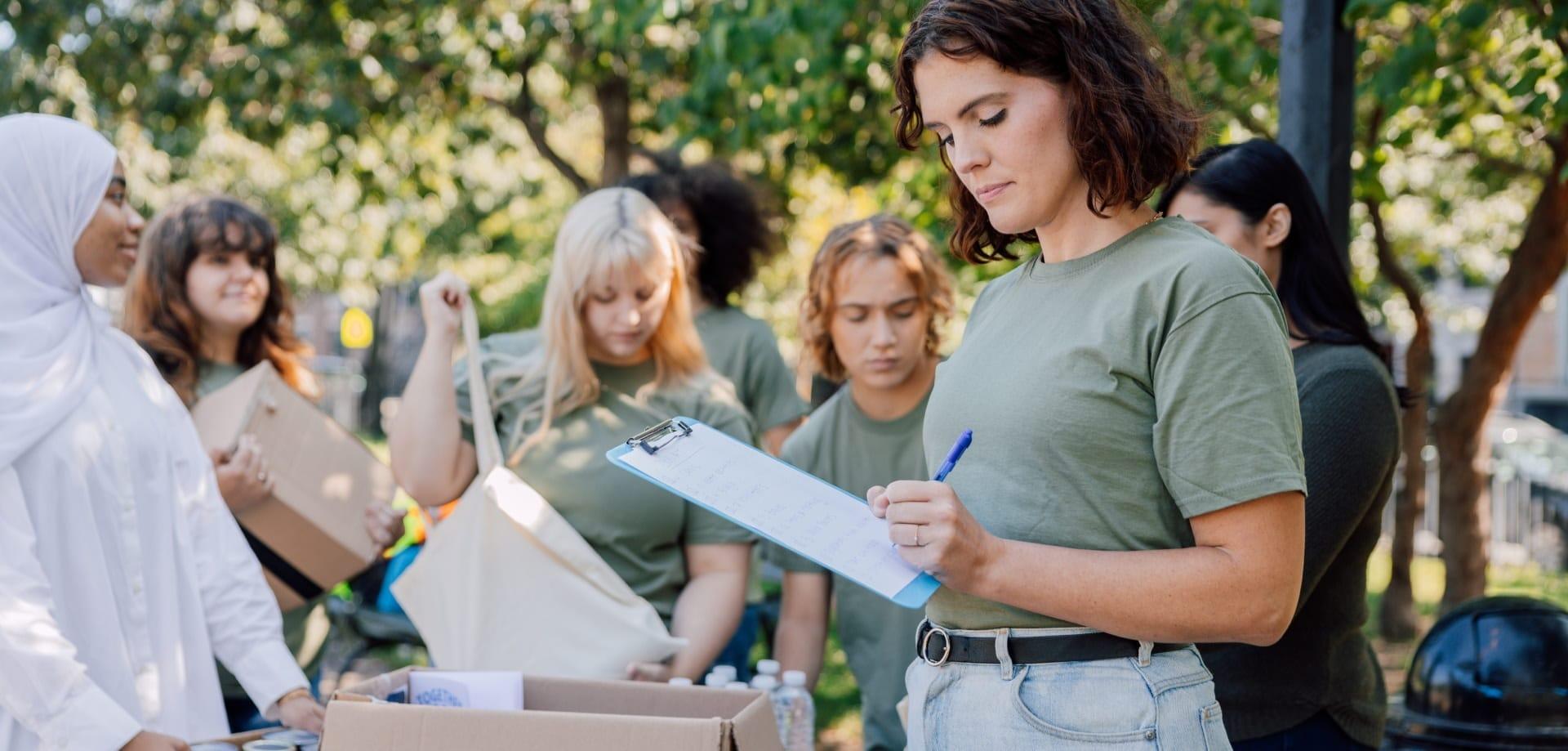 A group of people filling out a form