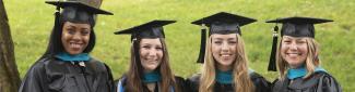 4 female MPA graduates smiling on graduation day