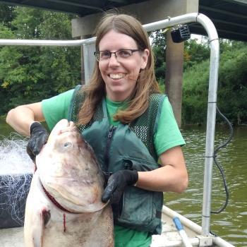 Photo of Amy Mackey and a very large fish.