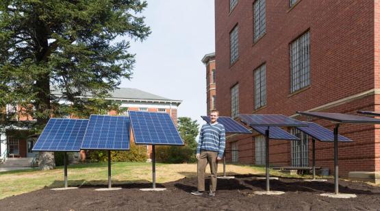 Man standing with solar panels